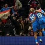 Atletico survive Spurs scare